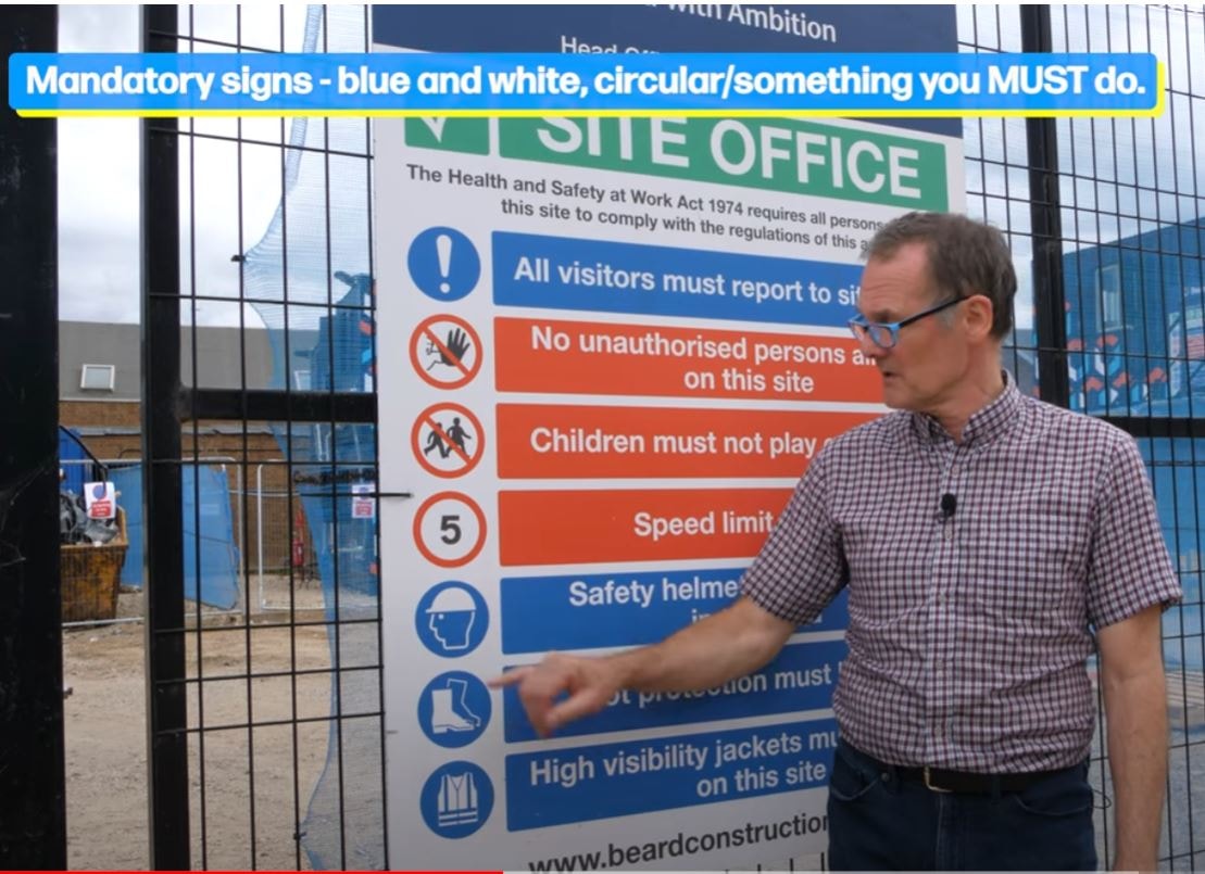 Paul explaining mandatory safety signs on a live construction site